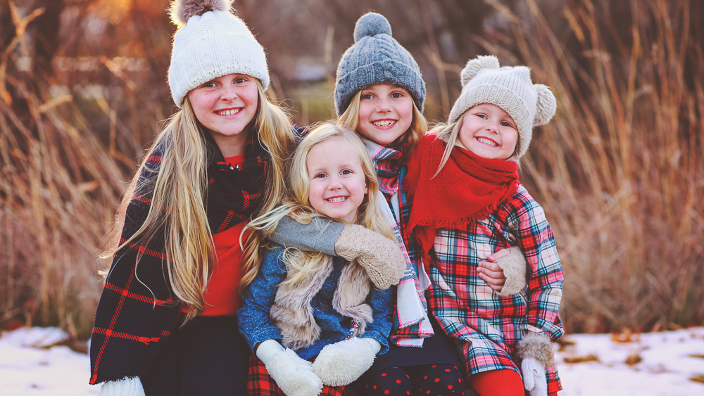 photograph of the austin girls during a winter photo session in ankeny iowa dressed in winter clothes