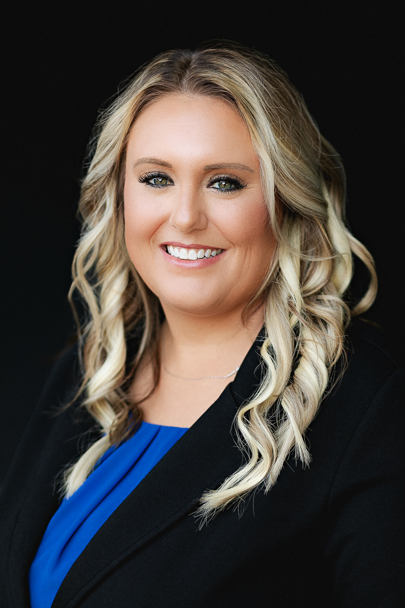 john deere ankeny corporate headshot of a woman in a blue blouse and black blazer